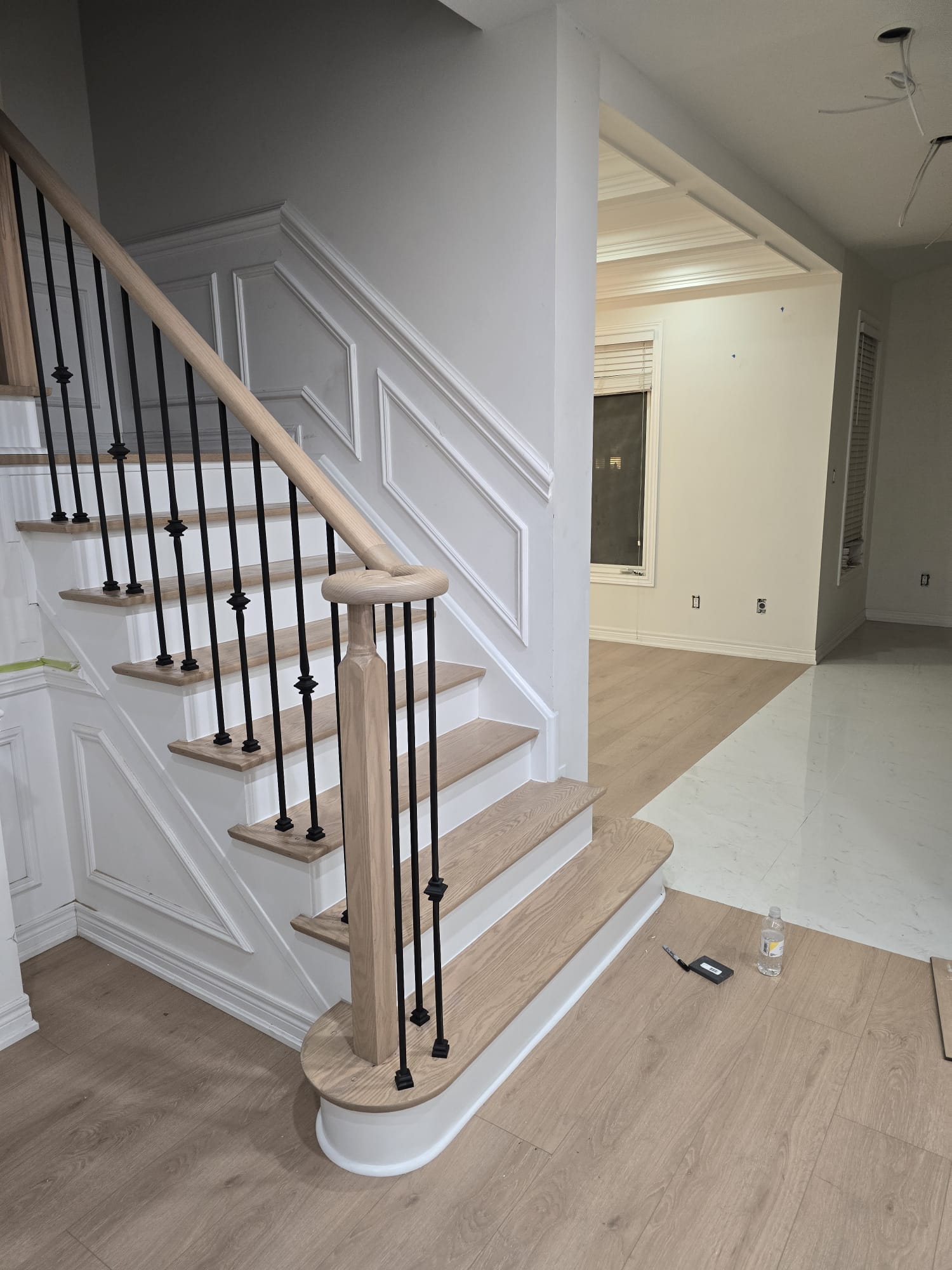 Hardwood stairs installation with finished treads and clean nosing lines